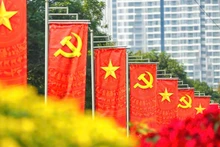 現金支給は、第14回党大会および旧正月（テト）を記念して行われる。