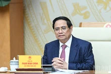 会合で発言するファム・ミン・チン首相（写真：チャン・ハイ）